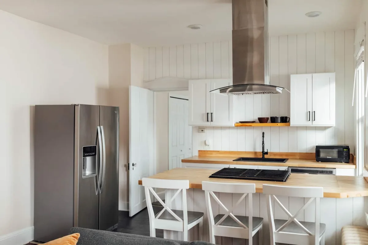 Kitchen island and stainless appliances at the Downtown Condo