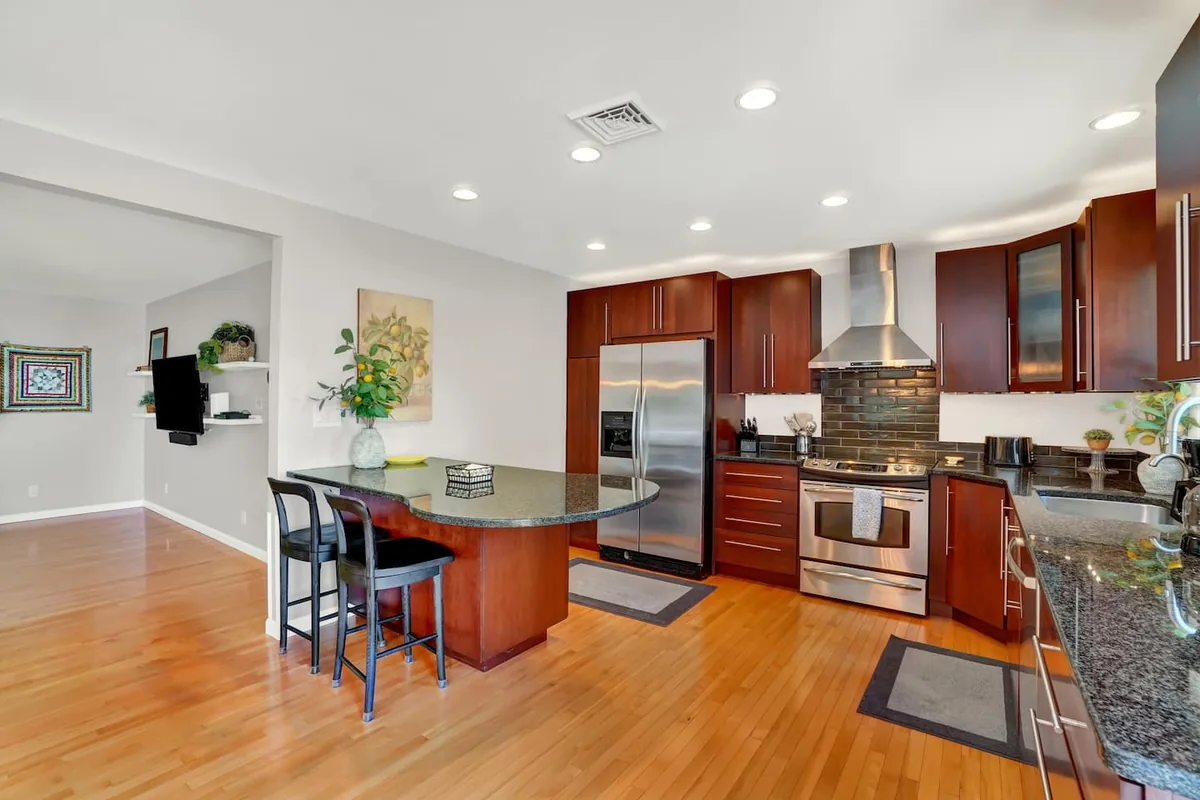 Open kitchen with stainless appliances at Lancaster Retreat
