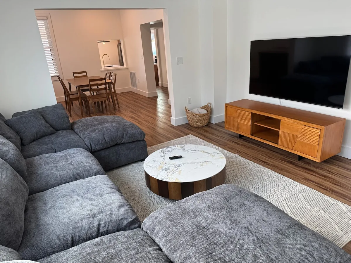 Living room with large sectional at the Marietta Bike House